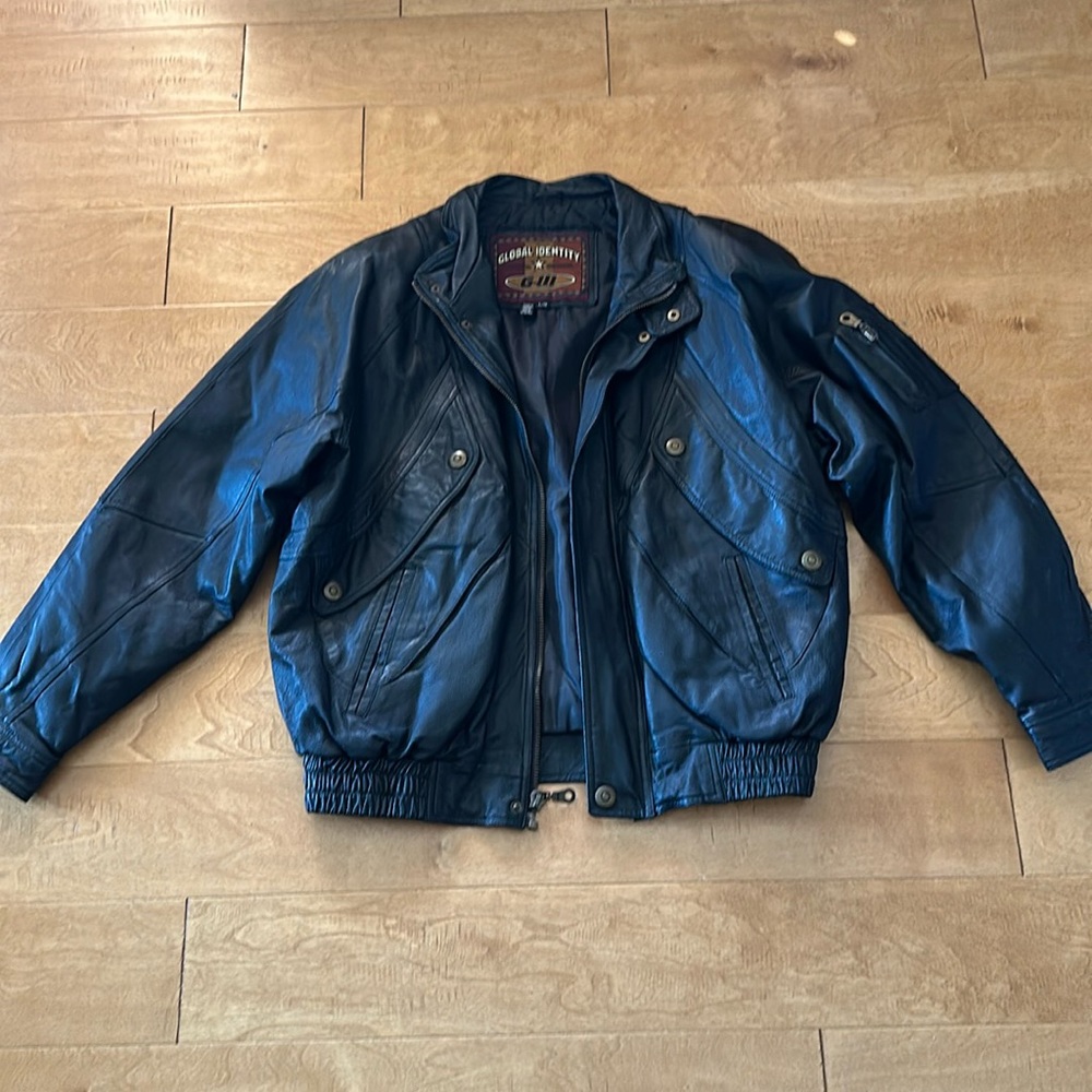100% Leather on shell jacket. Brand Global Identity. Size L